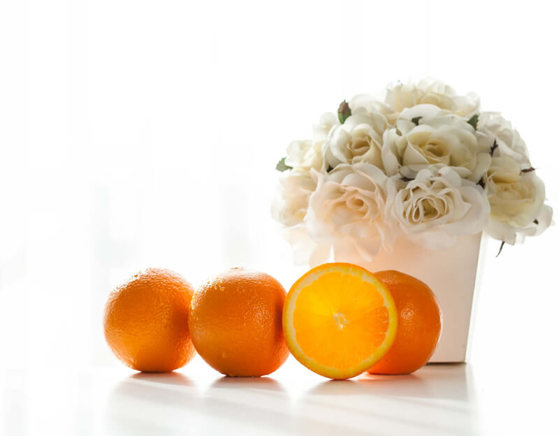 still life photography flowers and oranges