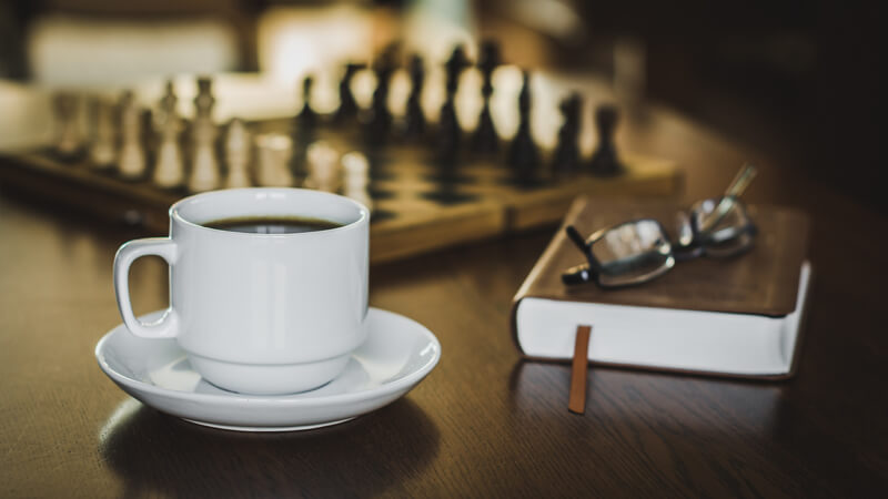 still life photography coffee and chess