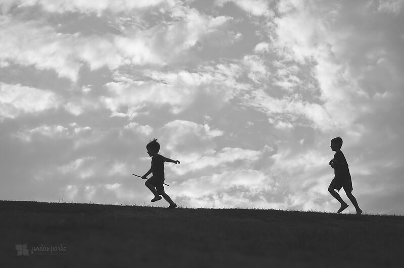 boys running black and white
