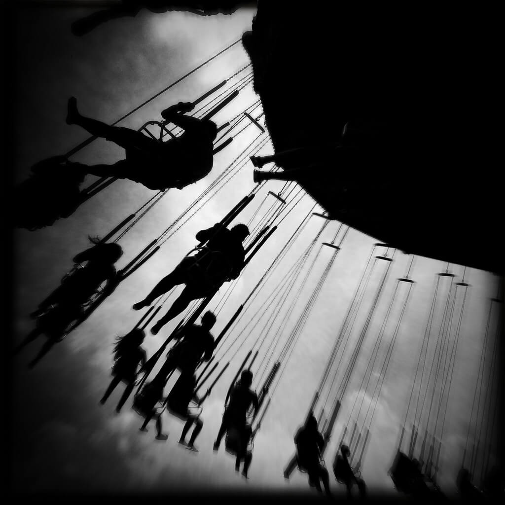 people riding on swing