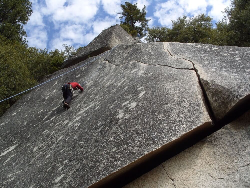 Ryan Grimm - Working hard to stay on an unnamed 5.9 friction climb