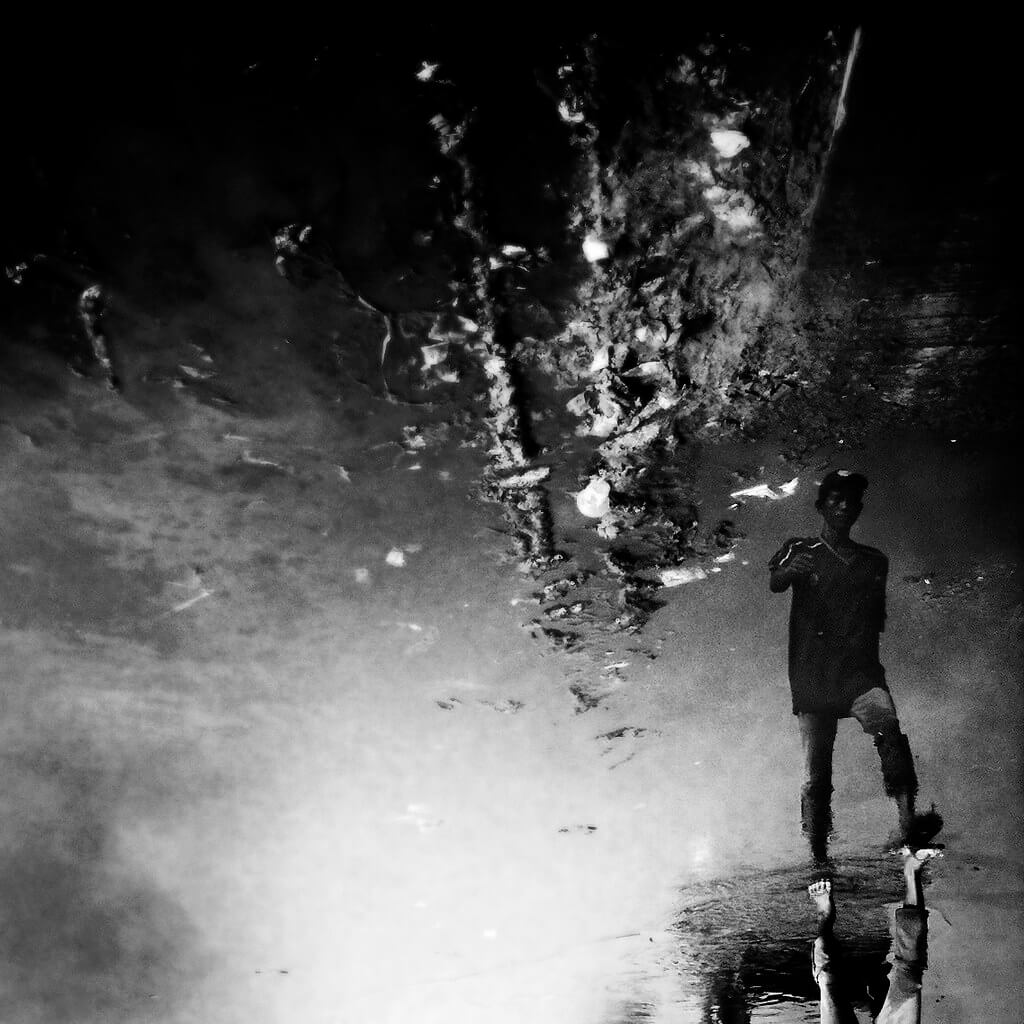 Shirren Lim - puddle reflection black and white