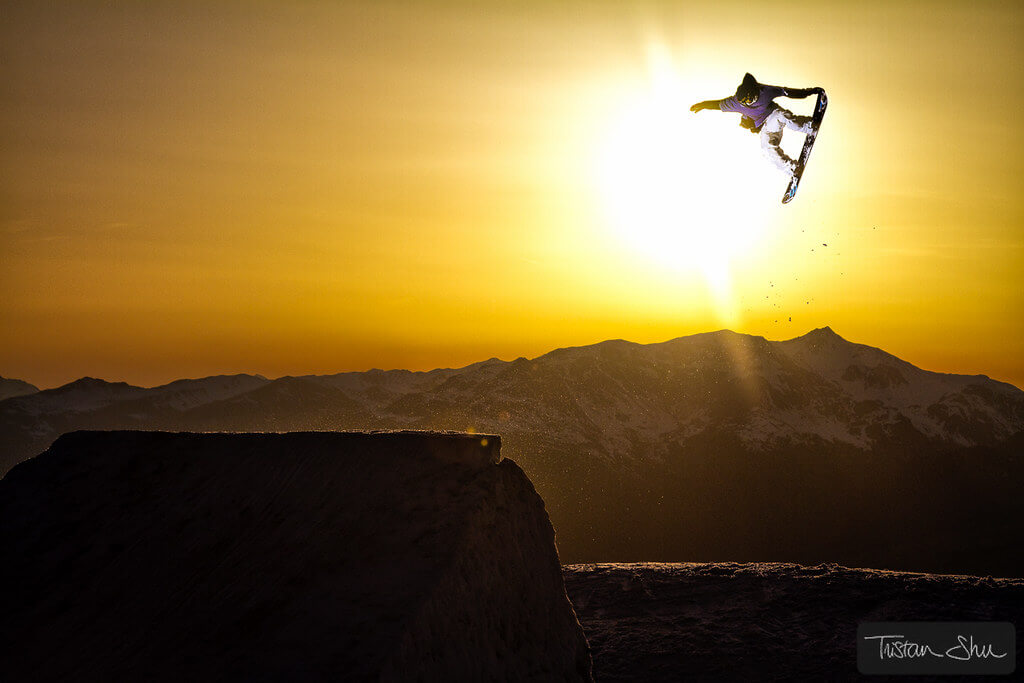 Tristan 'Shu' Lebeschu - Tail Grab Snowboarder at Sunset