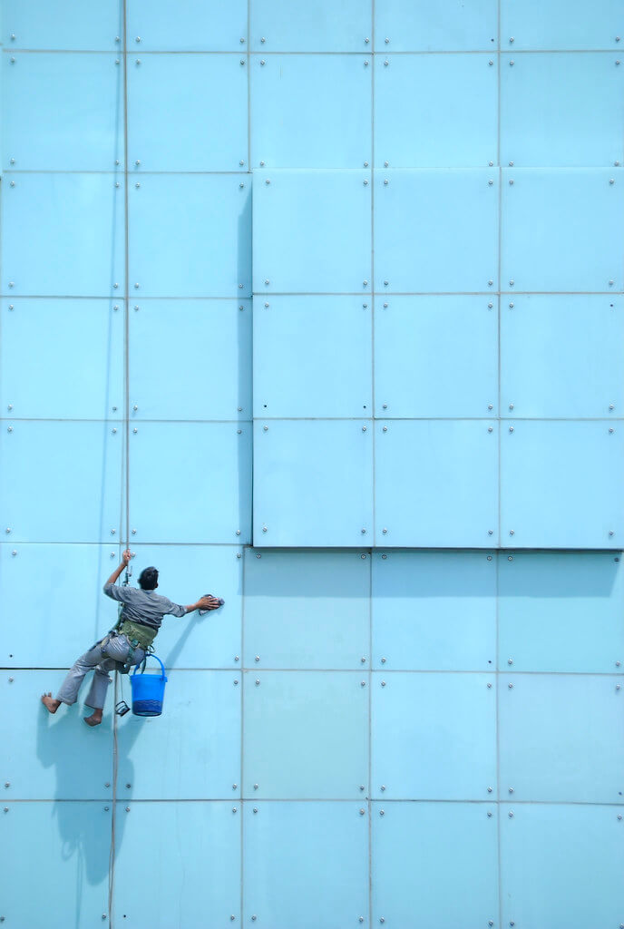 Nimit Nigam - Guy Cleaning Windows of Hotel New Delhi