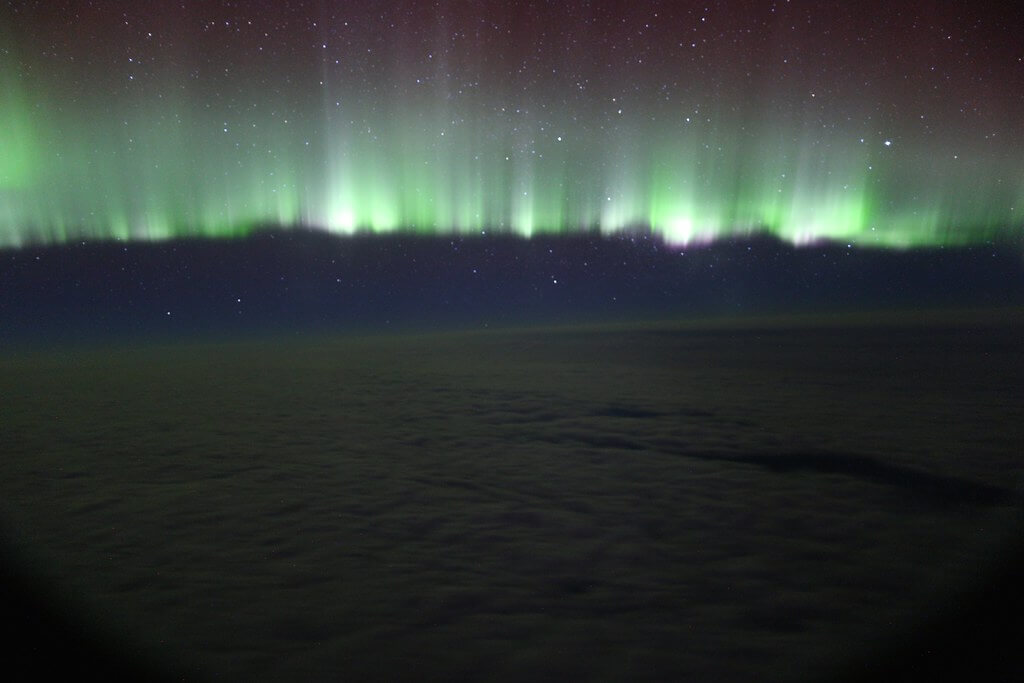 Paul Williams - northern lights through plane window