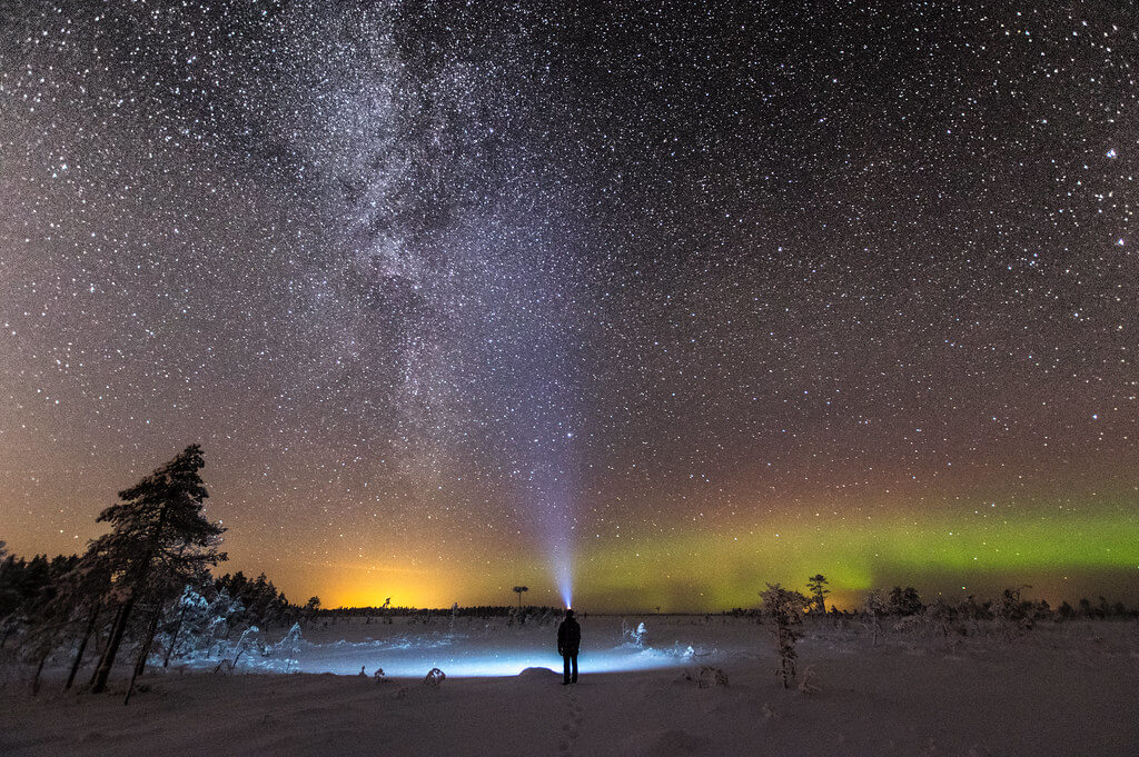 Juho Holmi - northern lights with flashlight