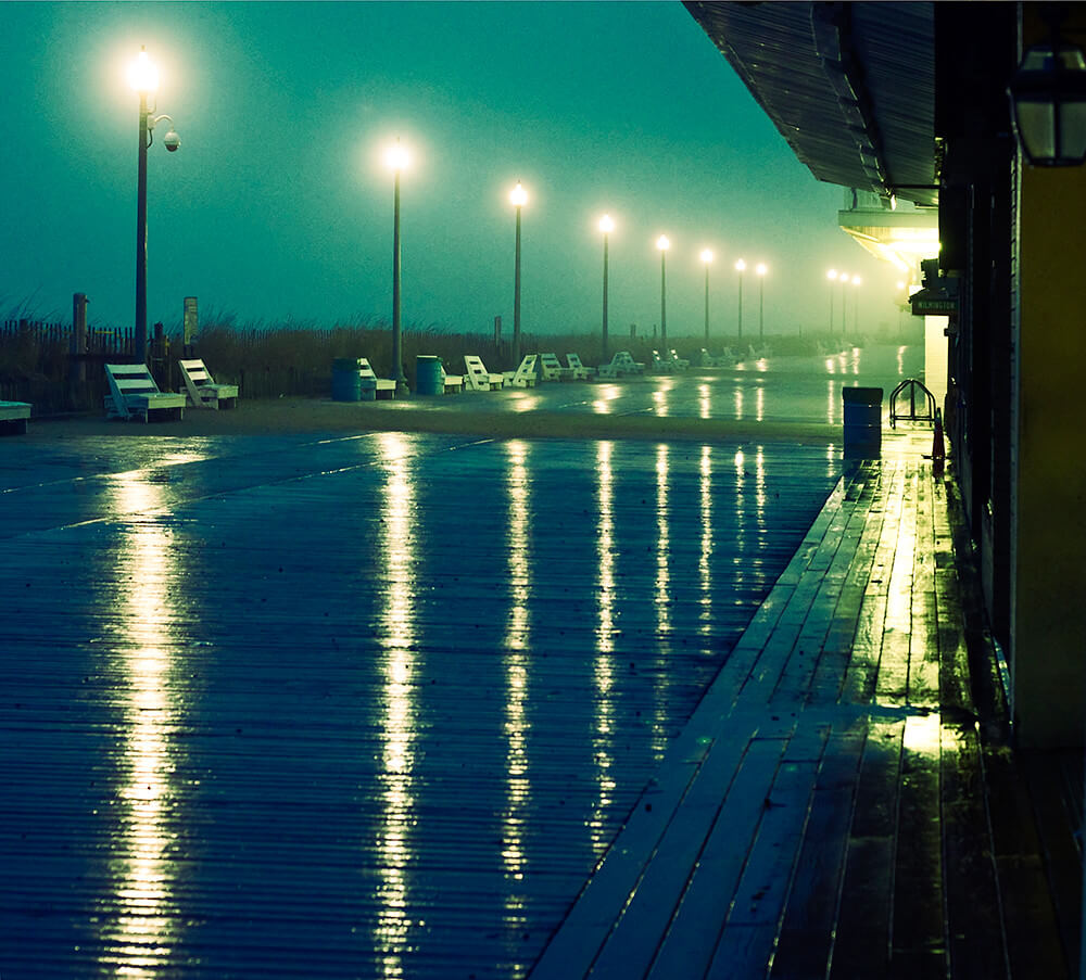 Victoria Pickering - Rehoboth Beach boardwalk in the rain at sunset