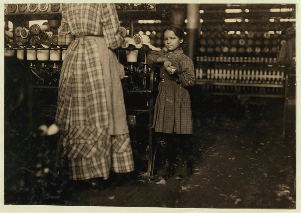 Lewis Wickes Hine - girl helping sister at mill