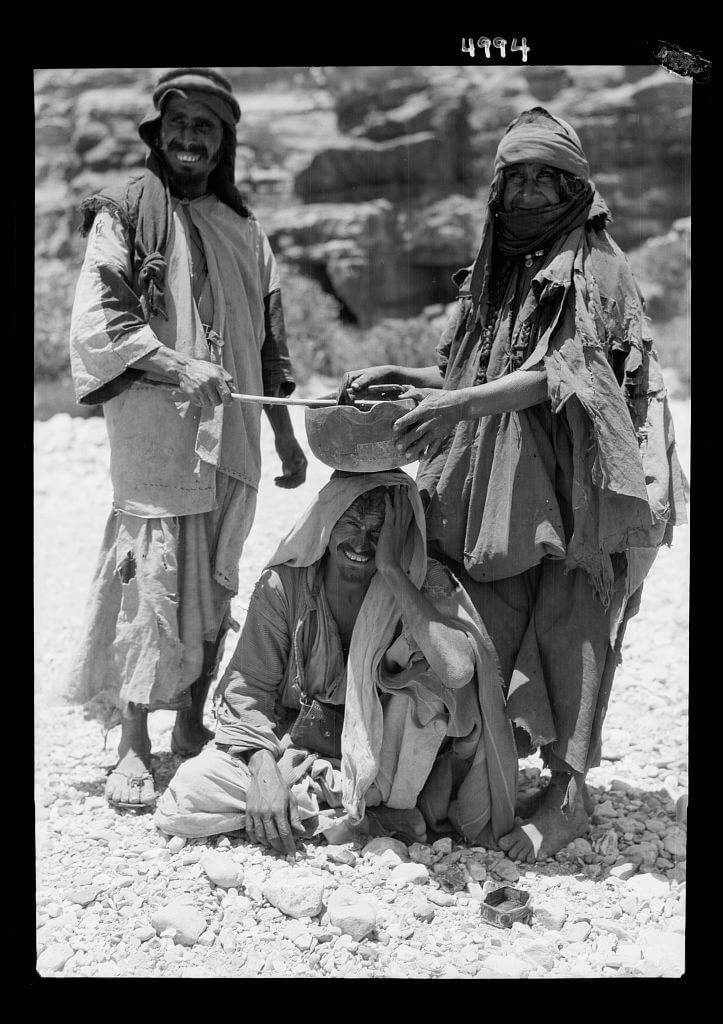 Bedouins performing an incantation over a sick man