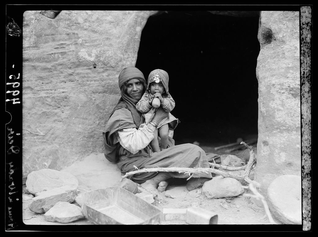 Bedouins Mother and baby before their cave home