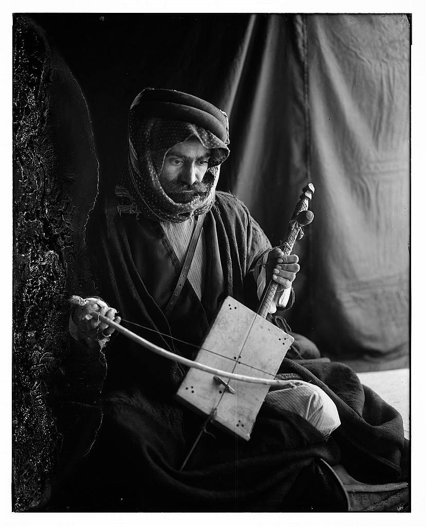 Bedouin man playing the rababeh with a bow