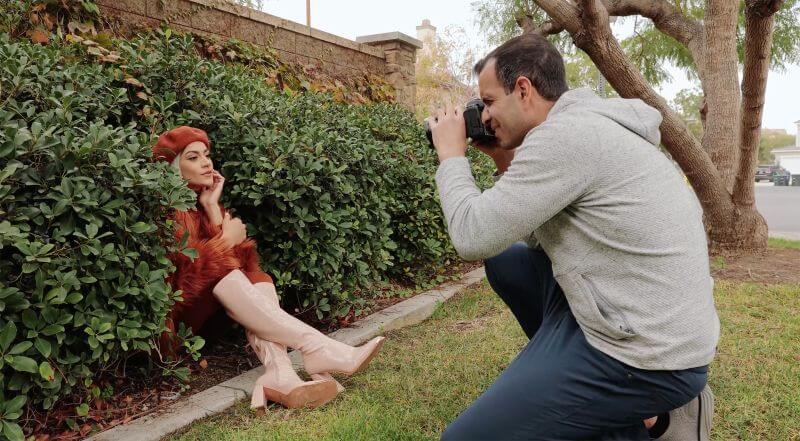 creative portrait photography BTS of portrait in the hedges